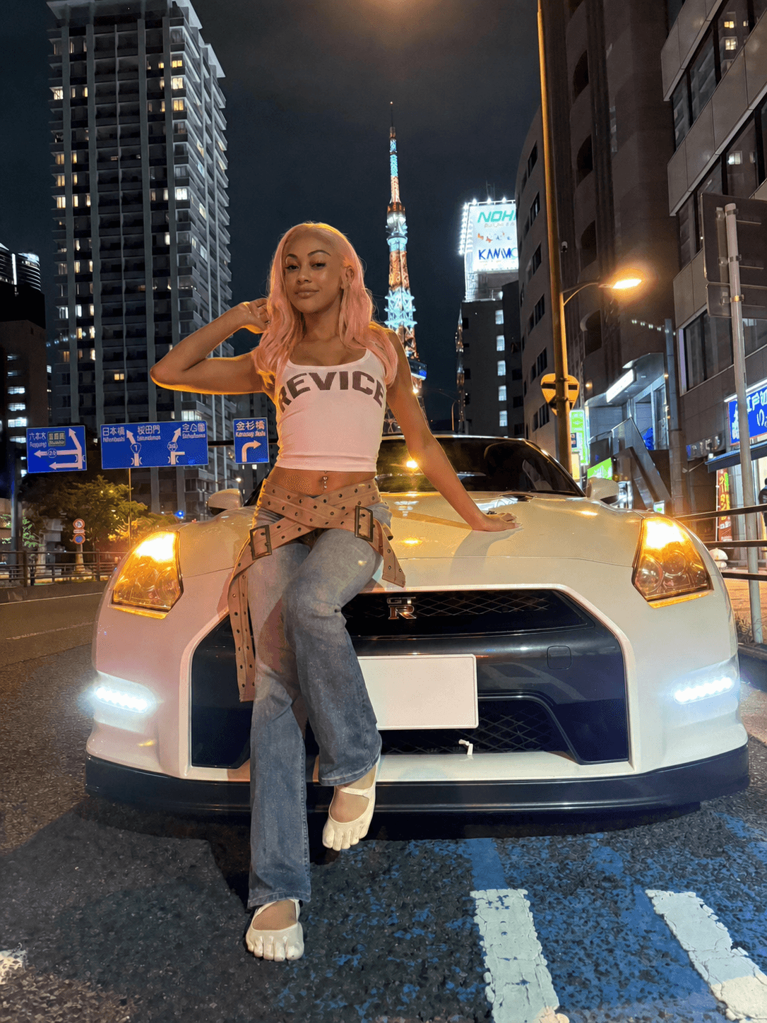 Guest with a Nissan GT-R R35 near Tokyo Tower at night