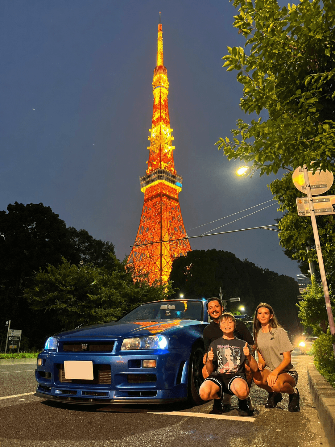 Family with a Nissan Skyline GT-R R34 at Tokyo Tower