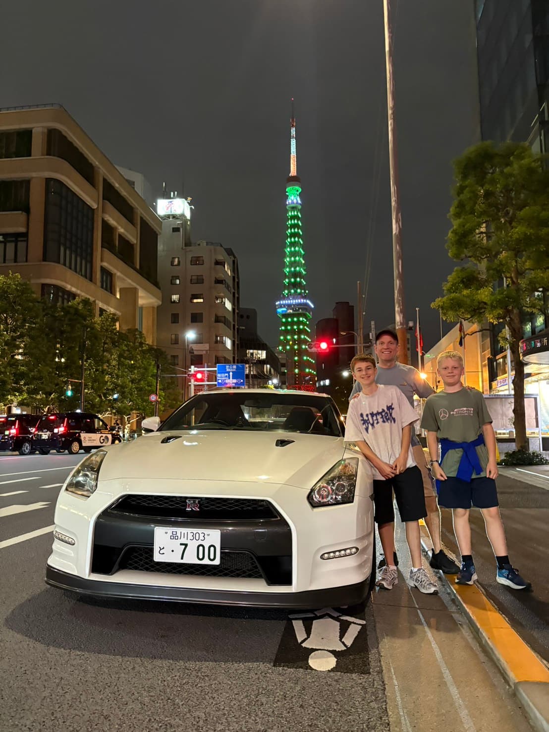 Family with a Nissan GT-R R35 near Tokyo Tower